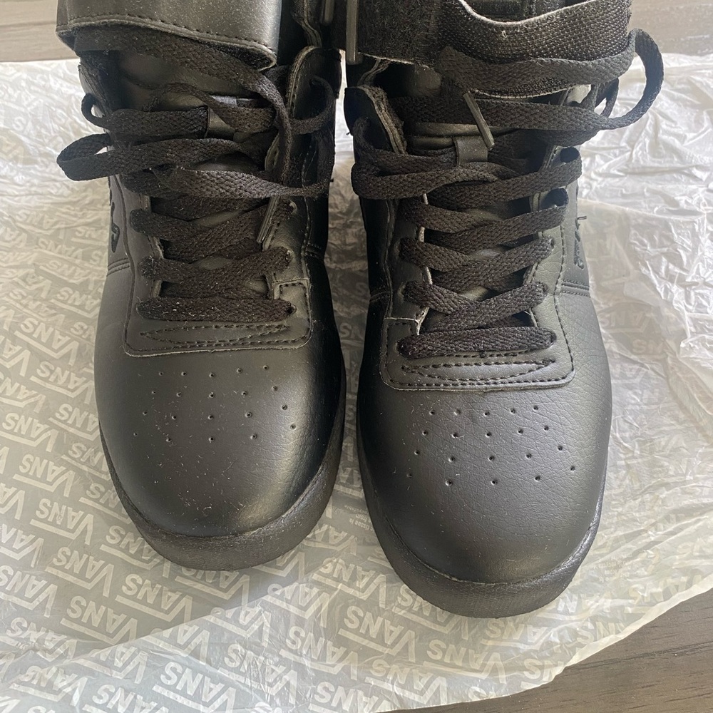 These are women’s black high-top Fila’s size 8.5( runs small). Worn twice
